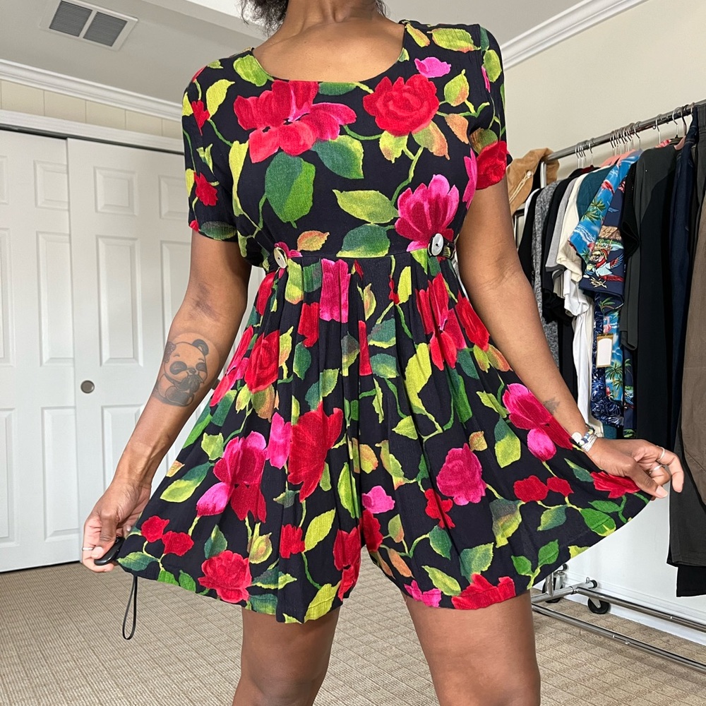 vintage floral jumpsuit romper. No pockets but ties in the back.  Size medium.